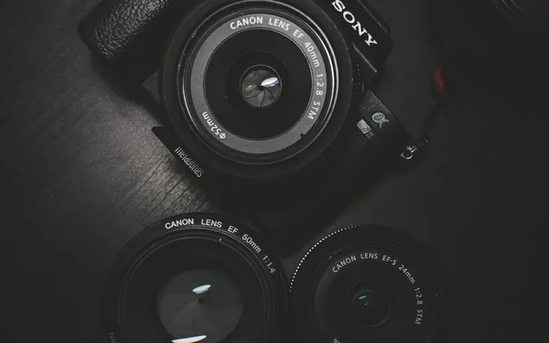 Compact camera held outdoors
